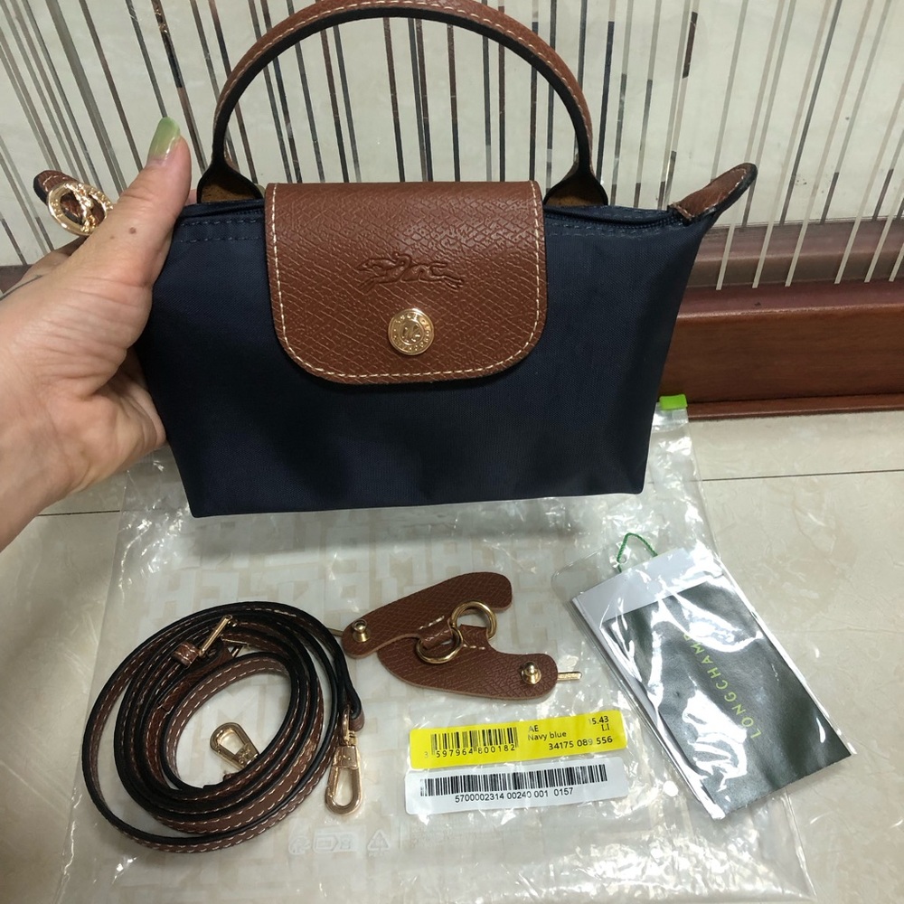 Longchamp navy nylon mini bag with brown leather trim